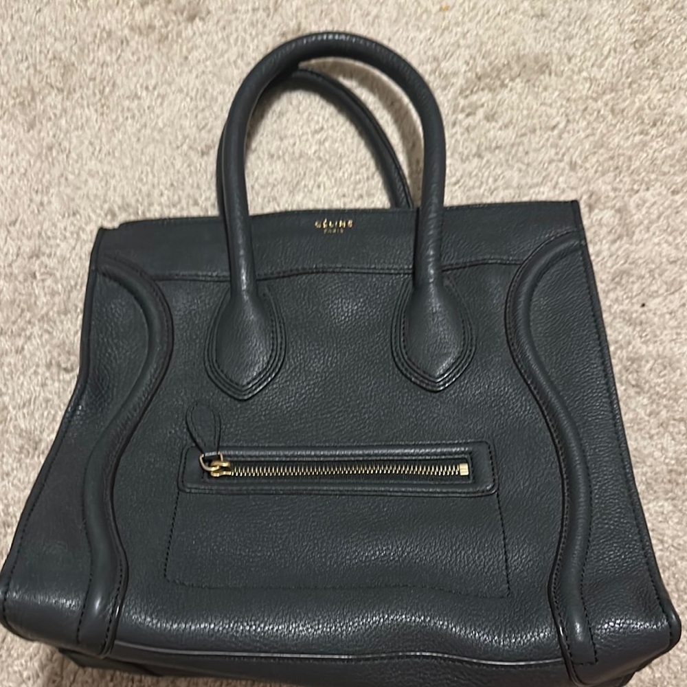 Celine luggage bag with pebbled leather dark navy color.
